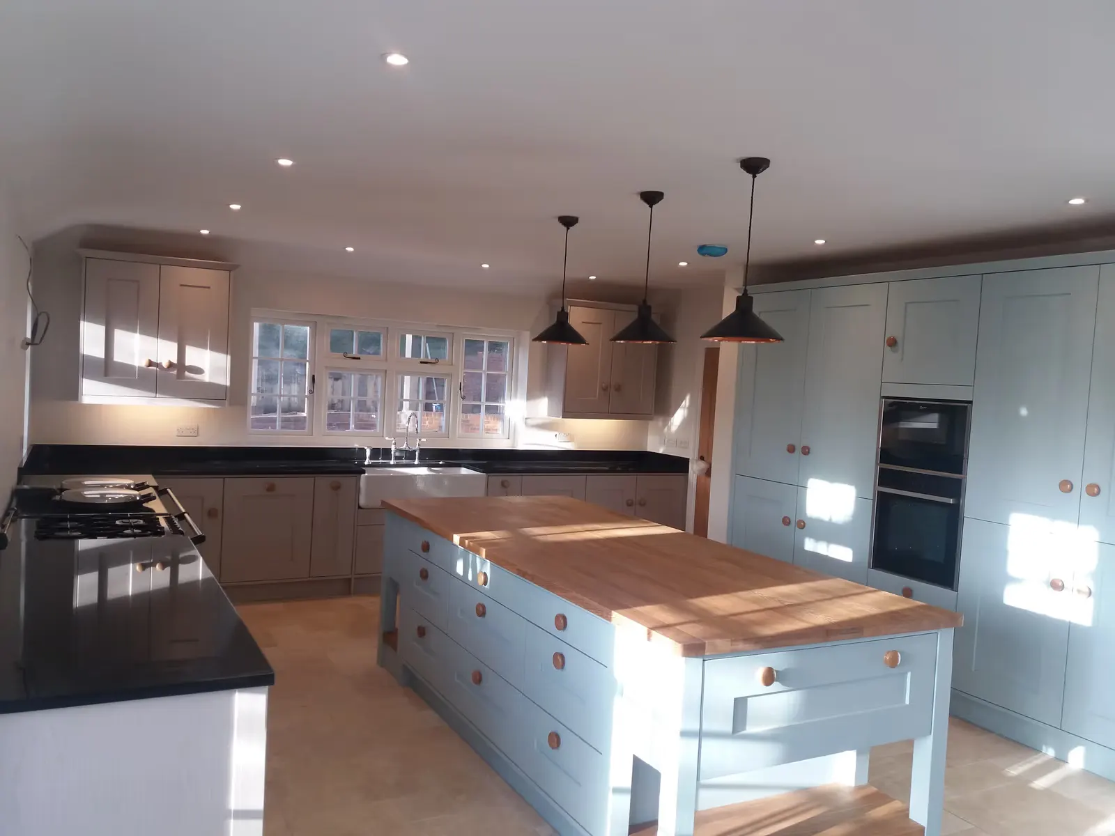 Shaker Kitchen Renovation with Copper Pendants